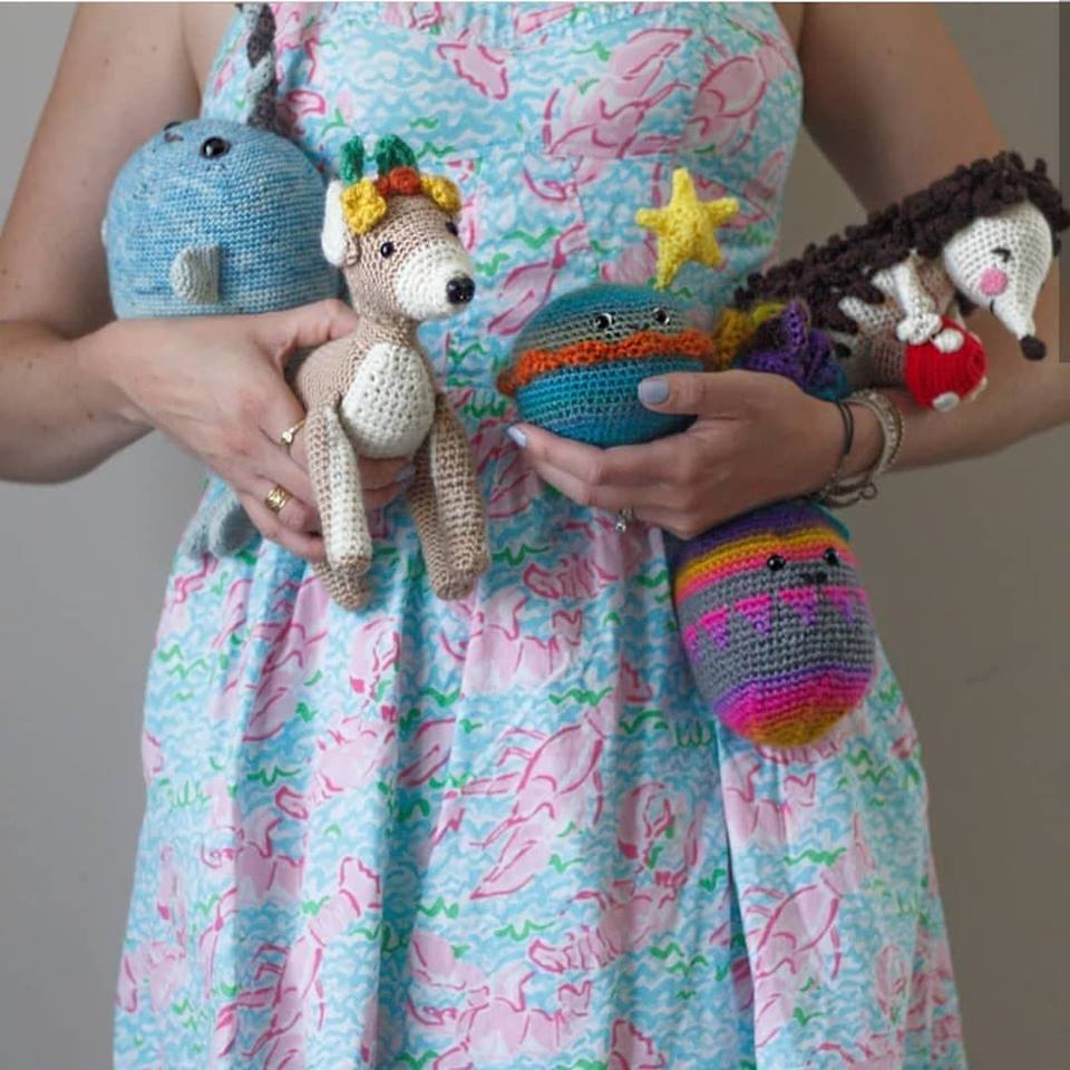 Lee Sartori with a collection of amigurumi she has designed.